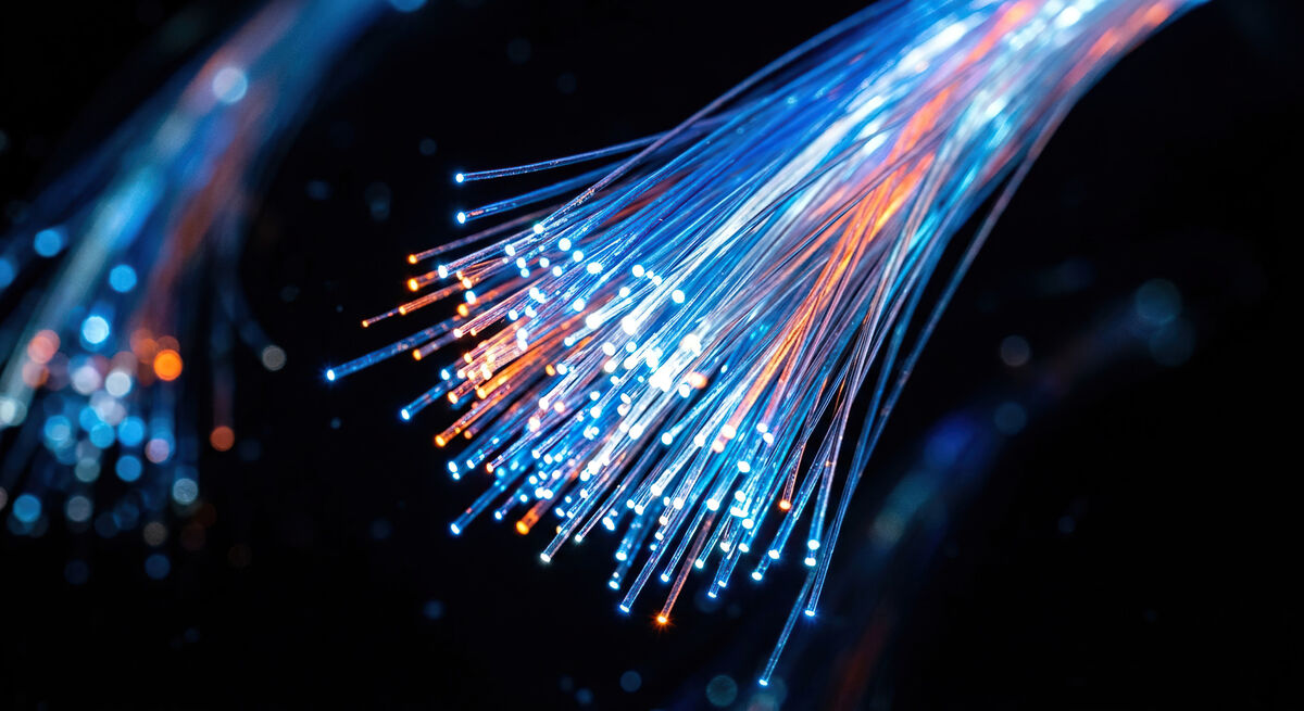 Glowing fibre optic strands, the fibre network behind Talk2Me business broadband